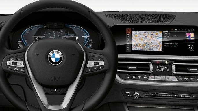 BMW 3 Series Sedan, 330e. Detailed frontal view of the BMW 3 Series Sedan cockpit with i-specific display.