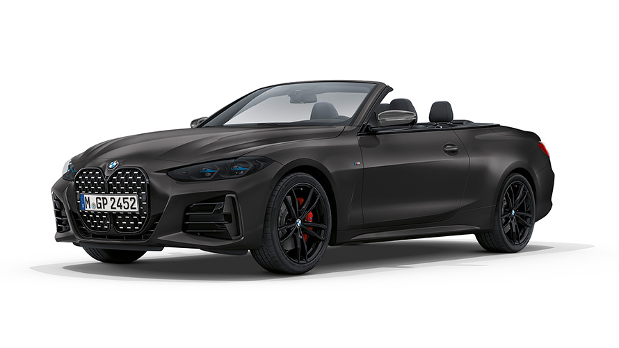 BMW M440i xDrive Cabrio G23 2020 BMW Individual Frozen Deep Grey metallizzato vista anteriore a tre quarti con capote in stoffa aperto