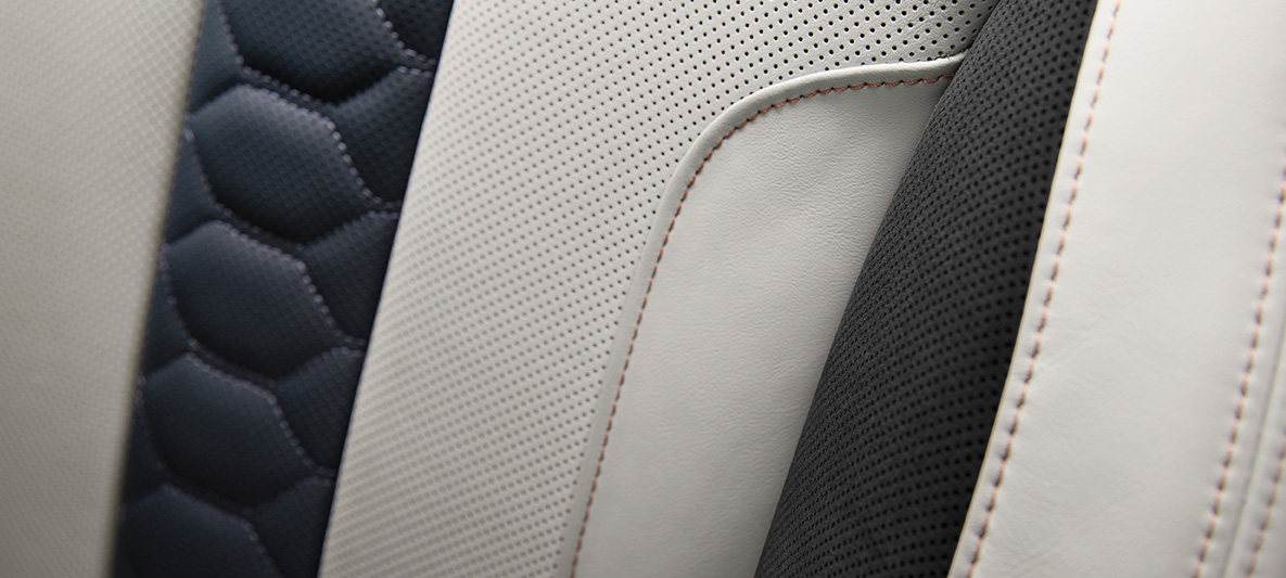 BMW X6 M SUV First Edition F96 2020 interior multifuctional seats full leather 'Merino'/Alcantara combination Silverstone/Night Blue contrasting stitching in Sakhir Orange detail view BMW X6 M SUV First Edition F96 2020 interior multifuctional seats full leather 'Merino'/Alcantara combination Silverstone/Night Blue contrasting stitching in Sakhir Orange detail view